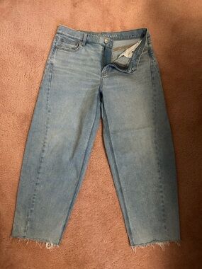 Light Wash Straight Leg Jeans with cutoff fringed ends. Never worn!
